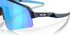 oakley sutro lite sweep sunglasses. A functional sport design with optimised coverage, extended field-of-view, retention and impact protection. navy frame with blue and purple lenses. close up view of lens and frame.
