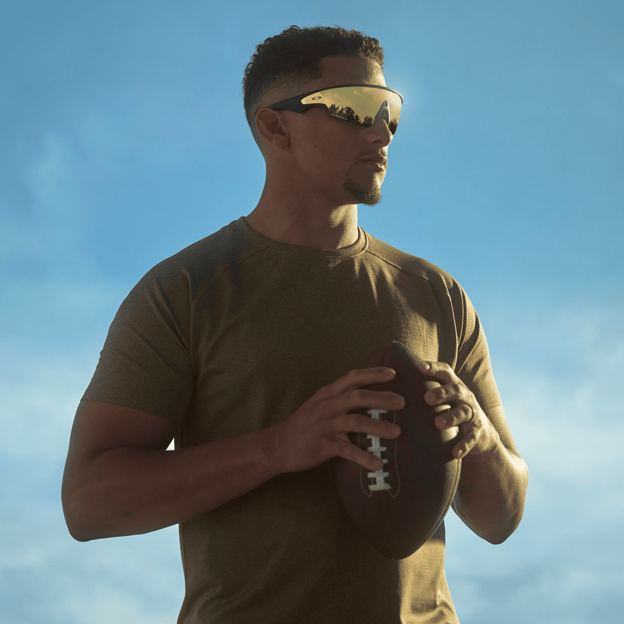 man wearing oakley meta vanguard ai glasses for running in prizm 24k bronze