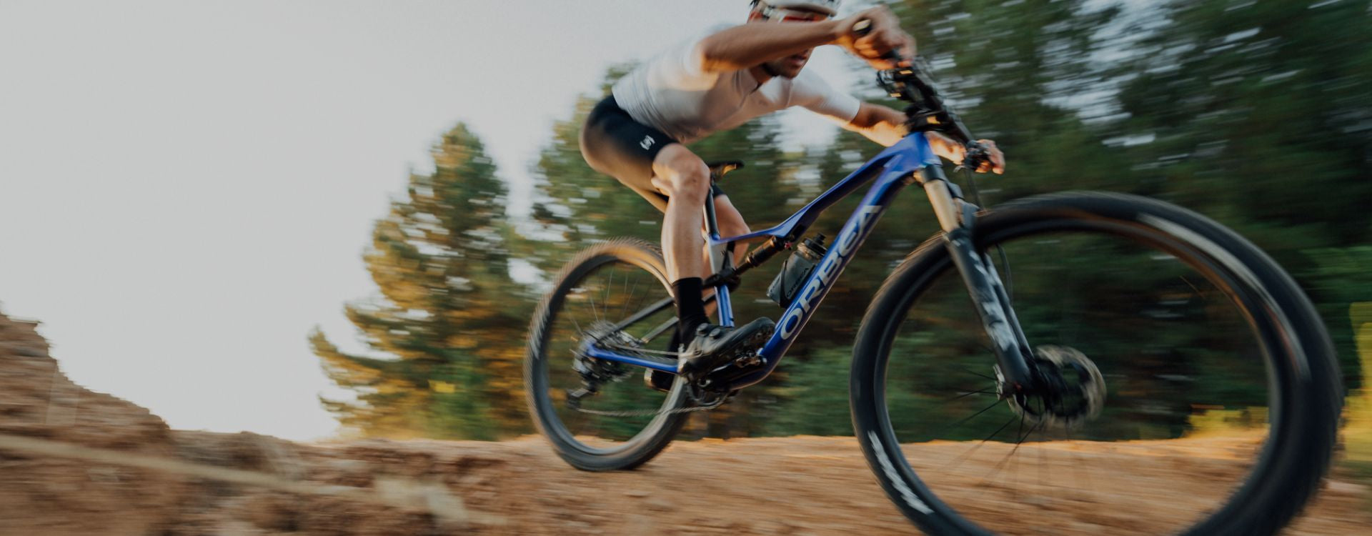 man riding orbea oiz xc mountain bike