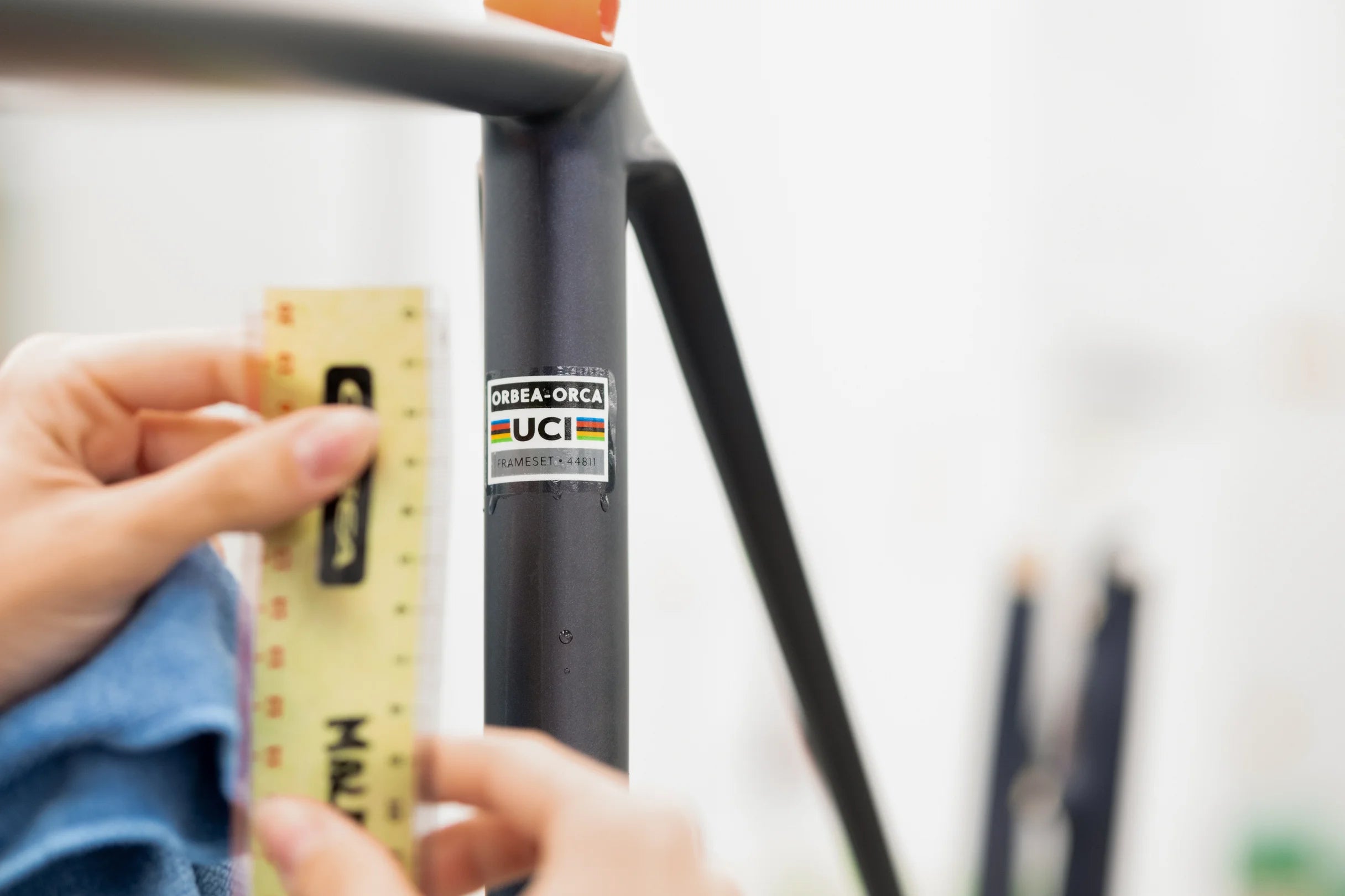 person measuring an orbea bike for customisation with MyO
