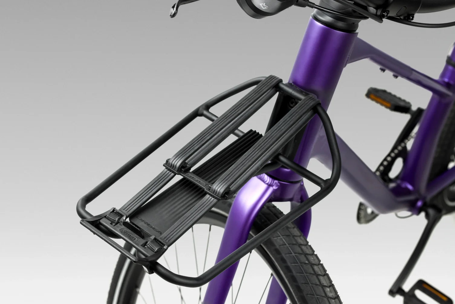 Close up of front rack on orbea vector with elastic straps to hold cargo
