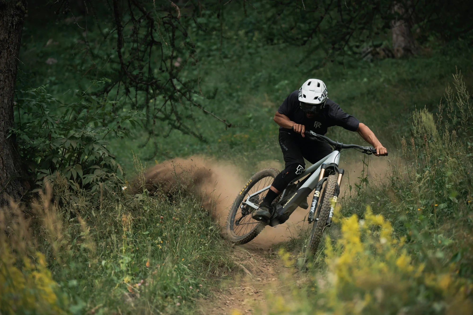 man mountain biking on an Orbea Wild, electric mountain bike
