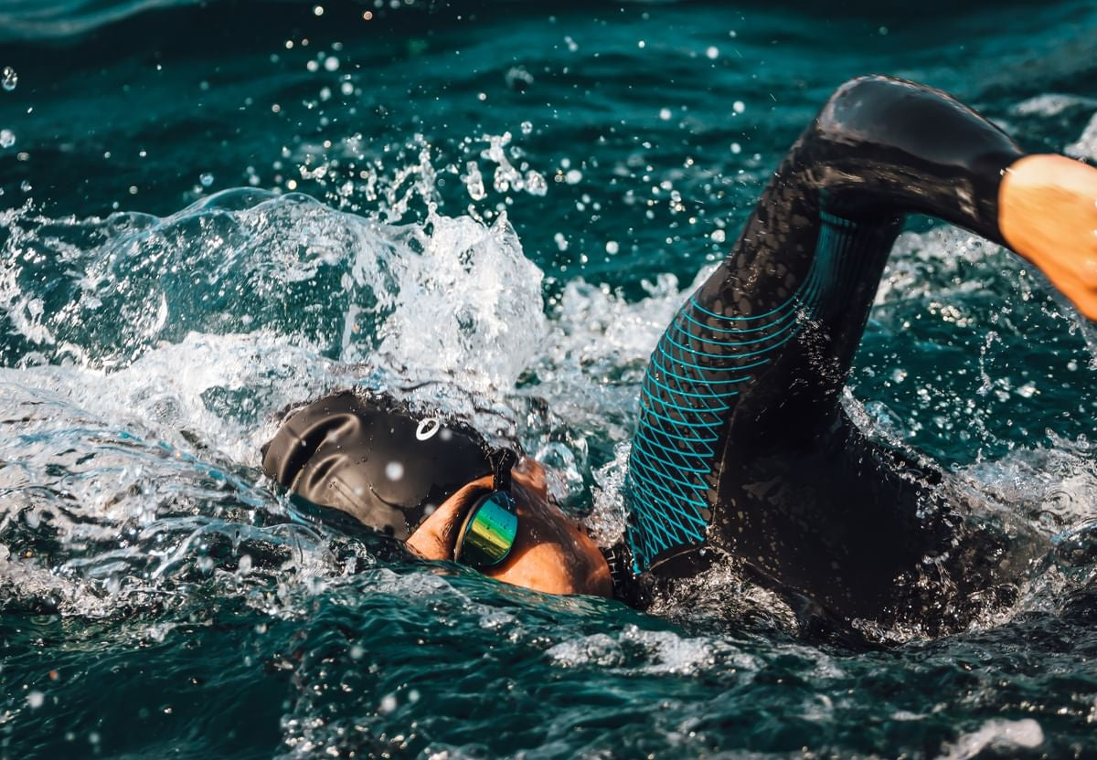 man swimming in sea in Orca Athlex Flex Triathlon wetsuit
