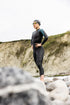Woman at beach wearing Orca Athlex Flex wetsuit for triathlons, great for extra flexibility in arms. 