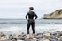Woman at beach wearing Orca Athlex Flex, triathlon wetsuit for women who need extra flexibility when swimming. 