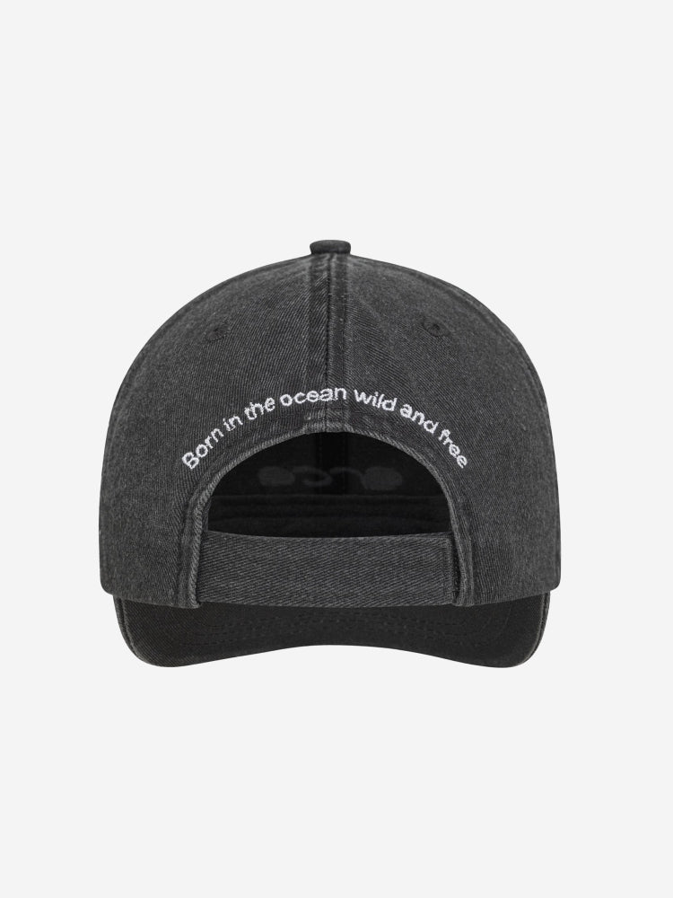 casual orca canvas cap, grey black with with tag line at back, born in the ocean wild and free
