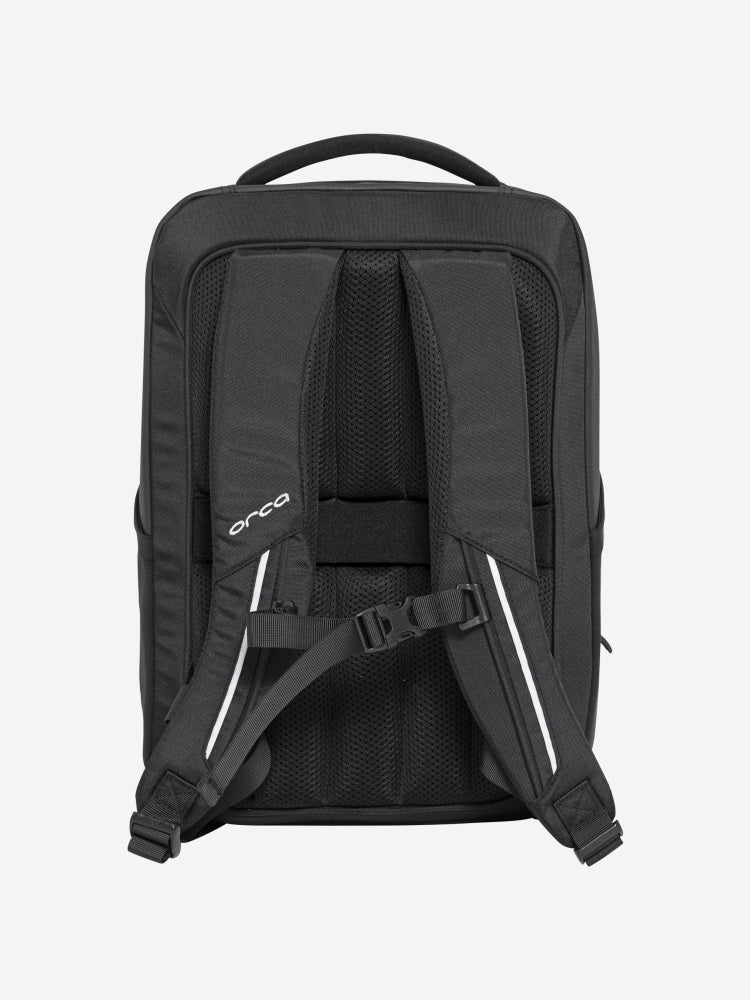 orca casual backpack in black, with soft and comfortable lower back support and space for a 15 inch laptop. Picture of back of backpack on white background.