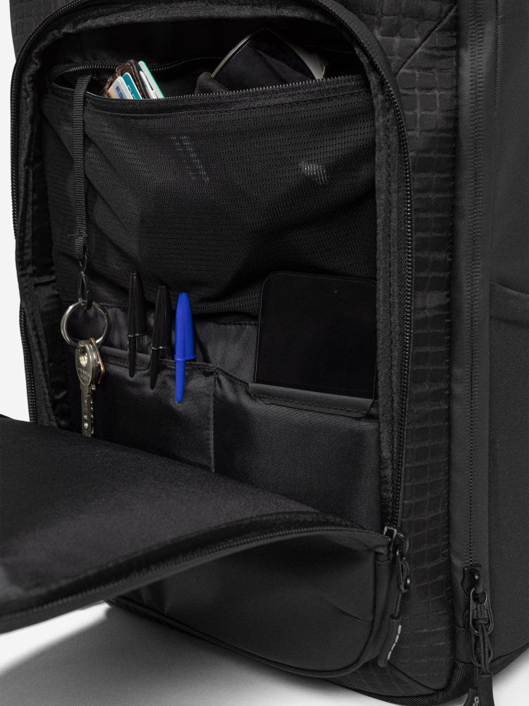orca casual backpack in black, with soft and comfortable lower back support and space for a 15 inch laptop. Picture of inside of backpack on white background.