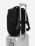 orca casual backpack in black, with soft and comfortable lower back support and space for a 15 inch laptop. Picture of backpack on a suitcase with a white background.