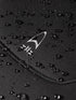 Close up of Orca Tango 5:4 surfing wetsuit for men showing water droplets running off the yamamoto neoprene