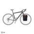 Bicycle with a black ortliebe pannier bag on a white background