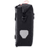 Black Ortlieb waterproof bag with a reflective patch on a white background
