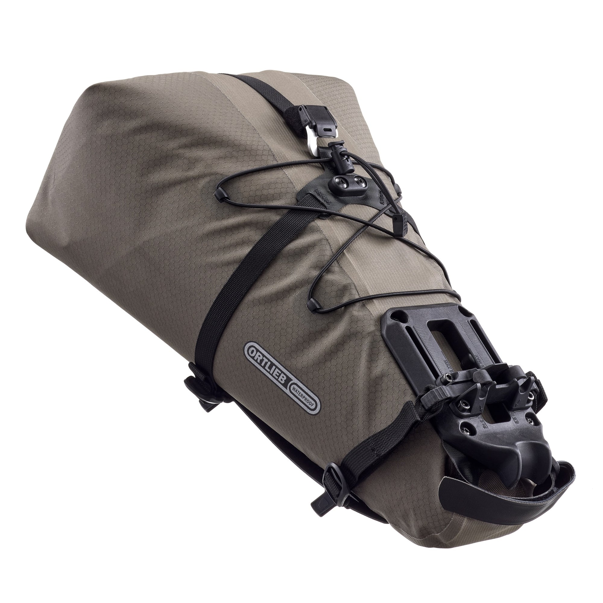 Brown ortlieb bikepacking bag with black straps and quick release mounting hardware on a white background