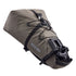 Brown ortlieb bikepacking bag with black straps and quick release mounting hardware on a white background