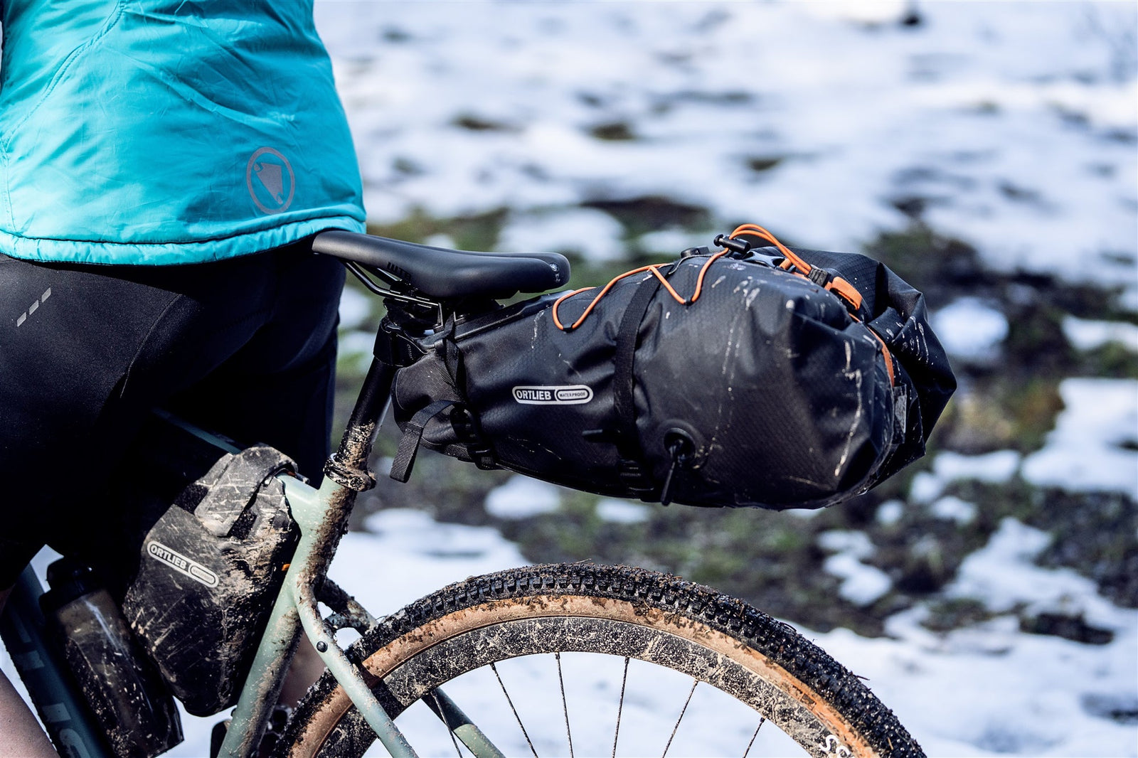 Bicycle with an ortlieb quick release black saddle bag on a snowy trail