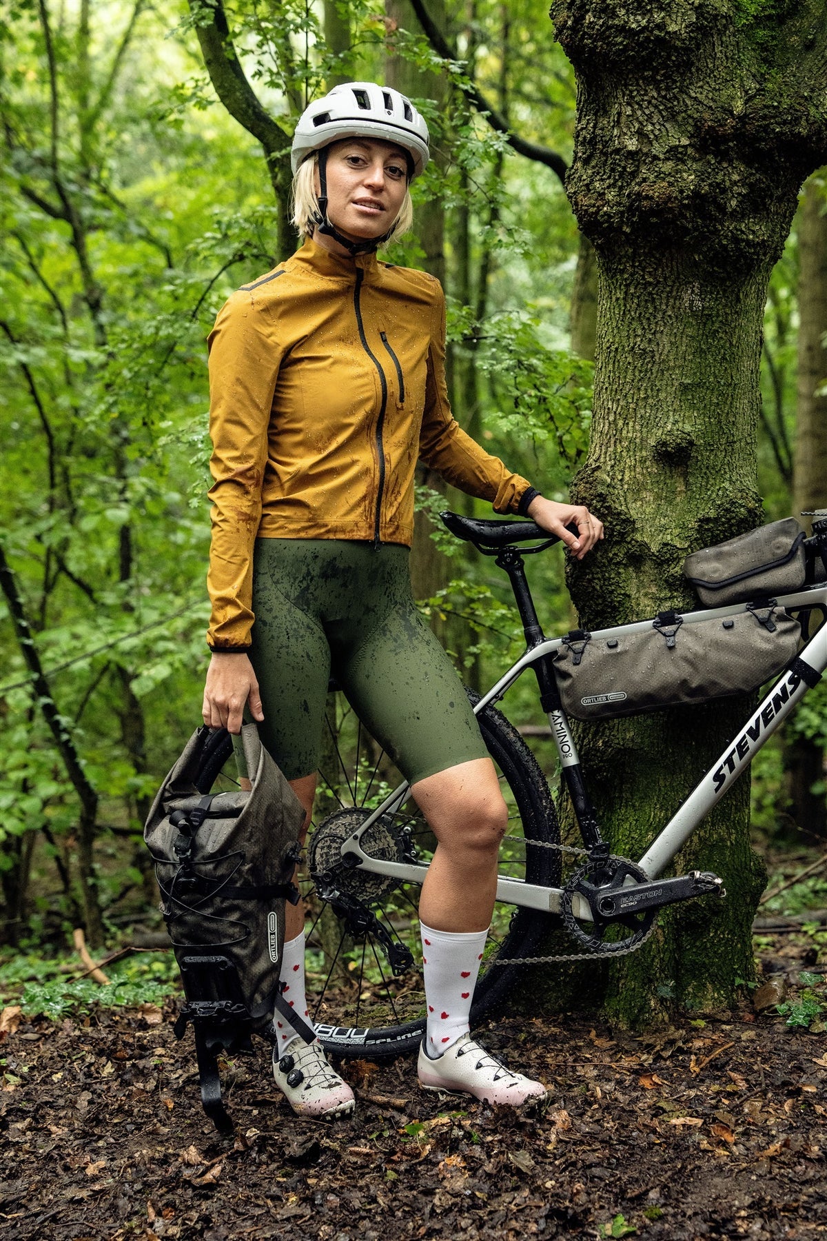 Person in cycling gear holding an ortlieb seat bag