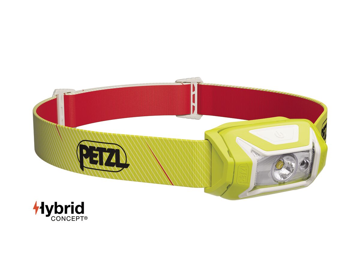 Yellow headlamp with red strap on a white background, featuring Petzl branding.