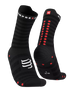 compressport pro racing ultralight run high quarter sock in black with red dots. Front on view of both socks.