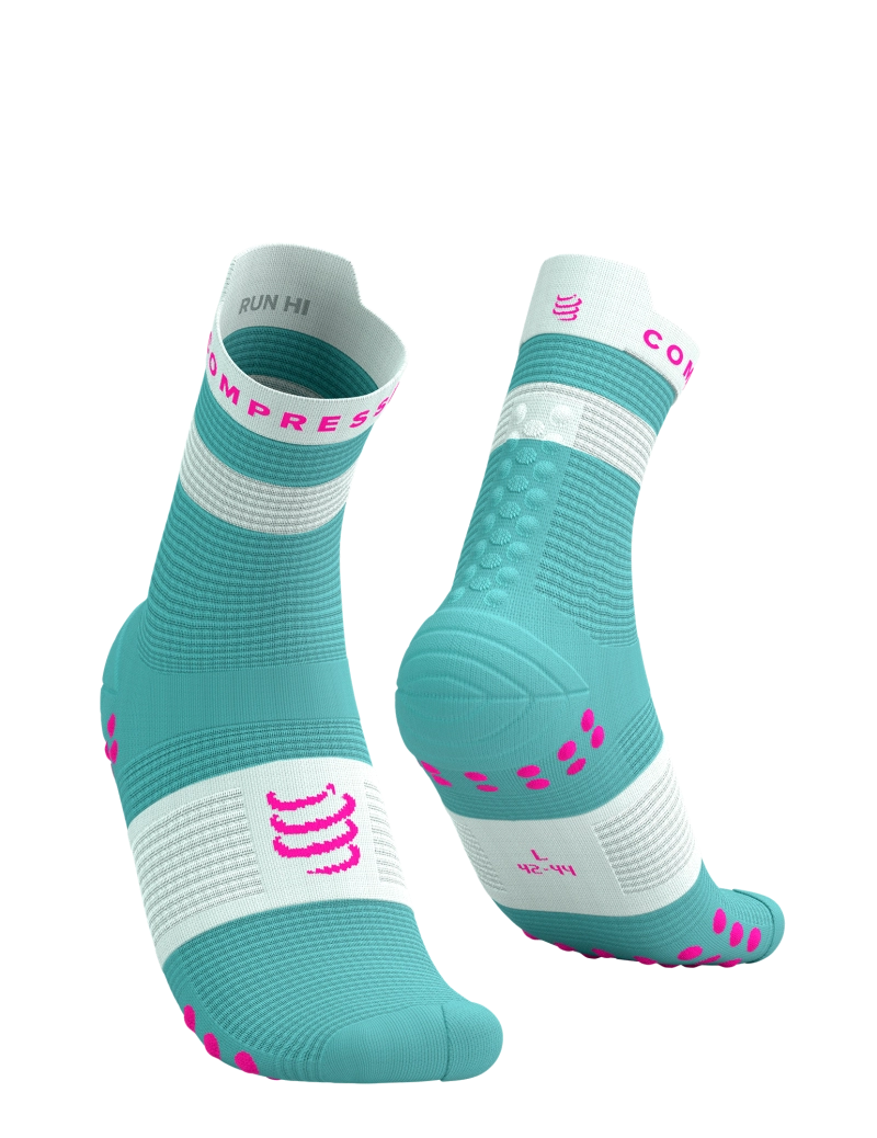 Teal and white socks with pink accents and compressport branding