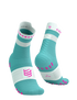 Teal and white socks with pink accents and compressport branding