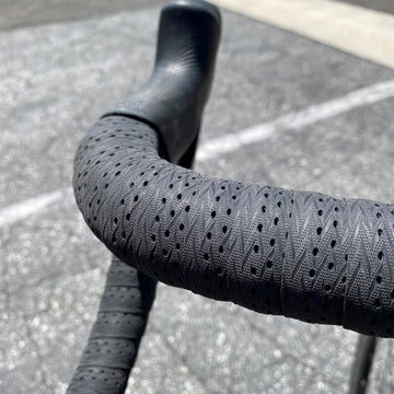 picture of profile design race handlebar tape in a black colour on a handlebar