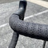 picture of profile design race handlebar tape in a black colour on a handlebar