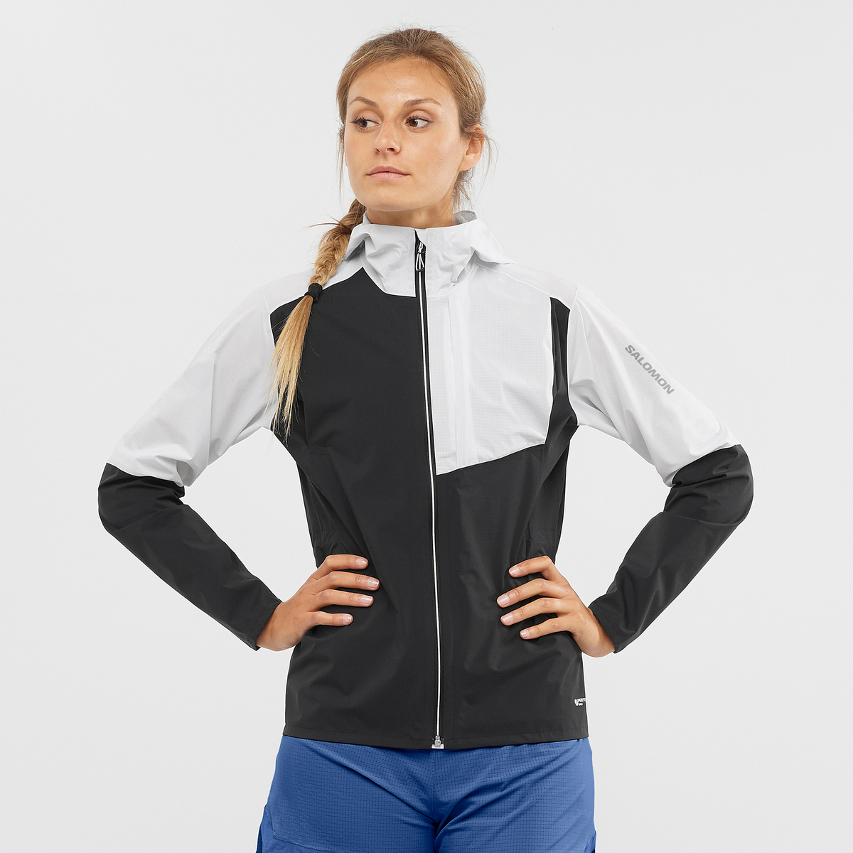 salomon bonatti trail jacket for women, waterproof trail running jacket, black and white, woman wearing jacket