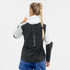 salomon bonatti trail jacket for women, waterproof trail running jacket, black and white, back of woman wearing jacket