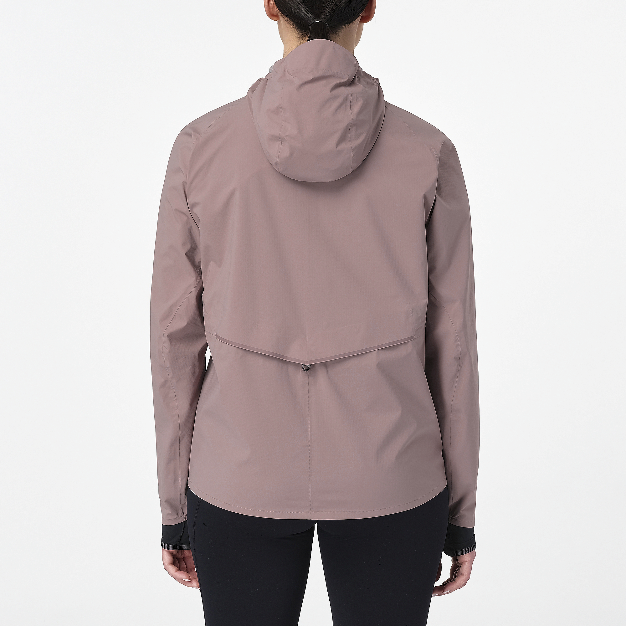 Woman wearing the salomon bonatti waterproof jacket, in antler colour, showing back features including hood and draw string