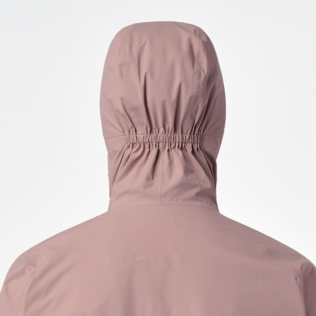 Close up of the hood on salomon bonatti waterproof jacket, in antler colour, showing elasticated feature to prevent hood blowing down in wind