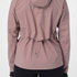 Close up of the salomon bonatti waterproof jacket, in antler colour, showing the drawstring pulled in at the waist