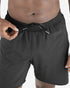 man wearing Salomon Shakeout Core 2in1 7" run short showing waist tie