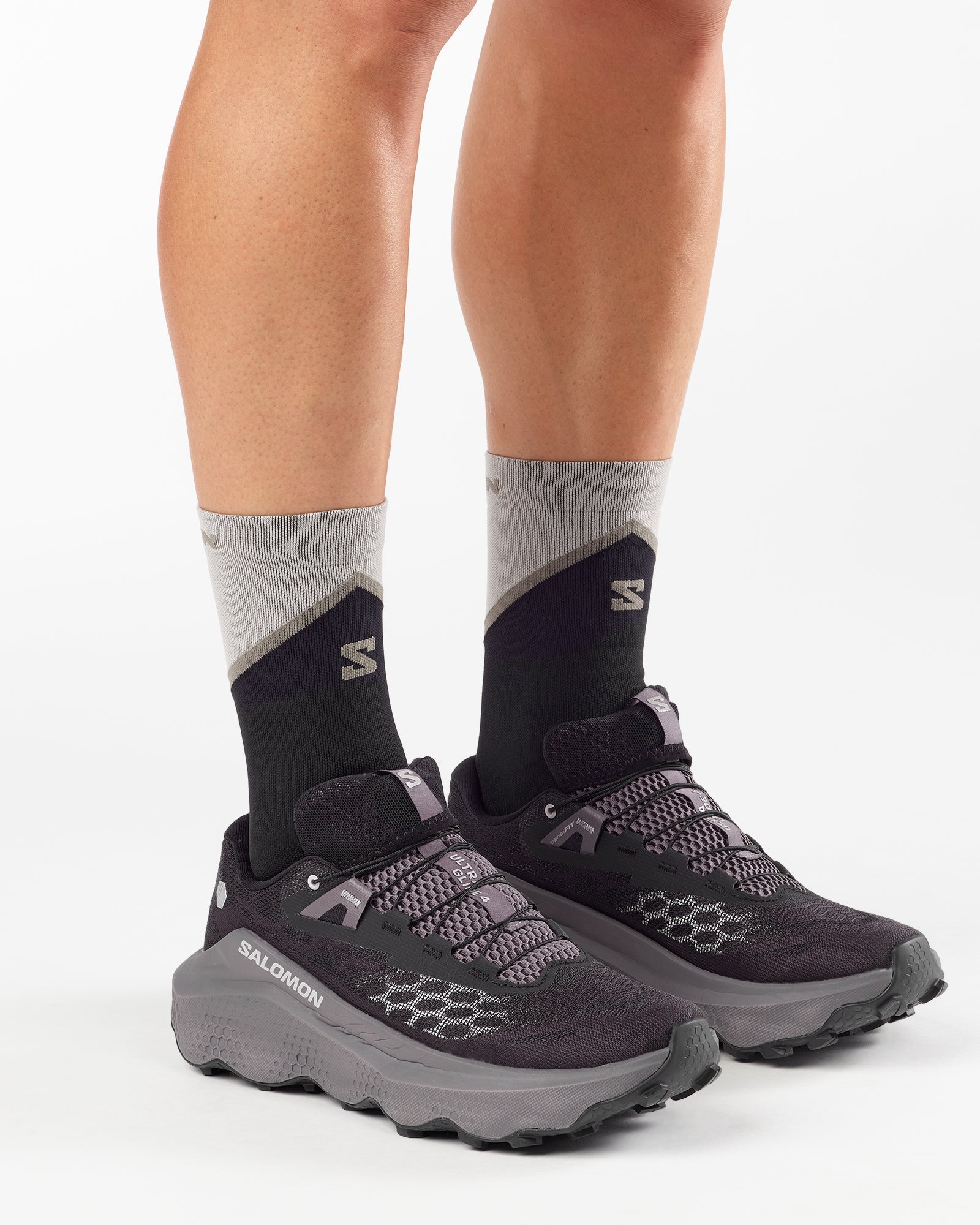 Man wearing Salomon Ultra Glide 4 trail running shoe in black, dark gull grey colour