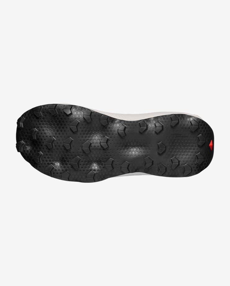mens salomon ultra glide 4, mens trail shoe in the fiery red, vanilla ice, black colourway. side view of the shoes sole on white background.