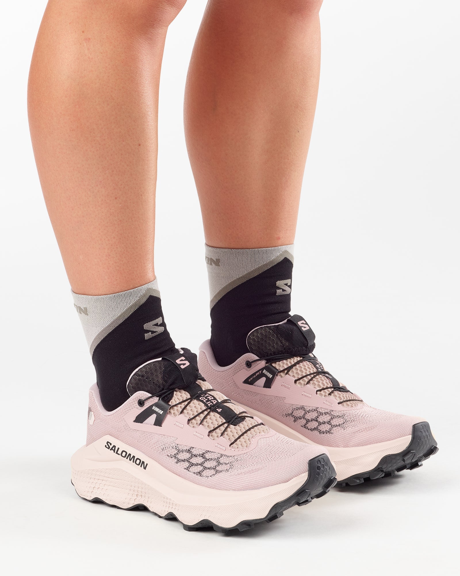 Woman wearing Salomon Ultra Glide 4 trail running shoes in shadow grey tapioca colour