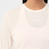 salomon womens shakeout core long sleeve, super breathable long sleeve shirt, white with light pink design, up close of chest logo on front of shirt