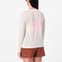 salomon womens shakeout core long sleeve, super breathable long sleeve shirt, white with light pink design, back of woman wearing shirt with pink logo