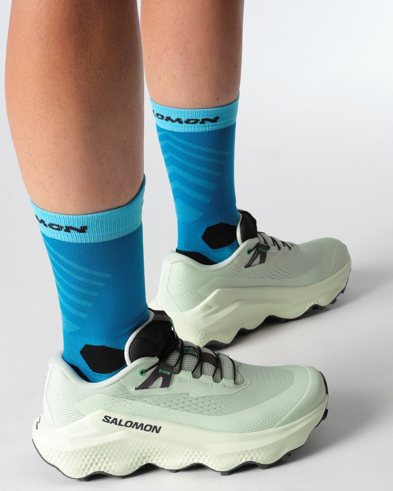 Light blue green salomon trail running shoe womens outside detail