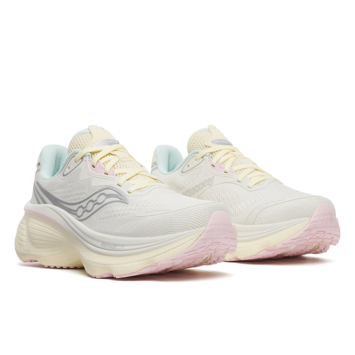 saucony hurricane 26 for women, supportive running shoe with maximum cushioning, white colour with pastel yellow, pink and aqua details, side profile of both shoes  on a white background