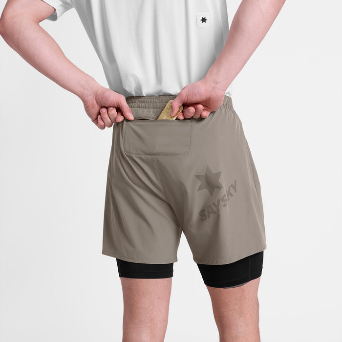 saysky pace 2-in-1 runnning short for men in taupe, comfortable running short with pockets, back profile of man wearing saysky shorts