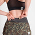 woman wearing saysky camo pace 2in1 run shorts for women showing storage pocket at back