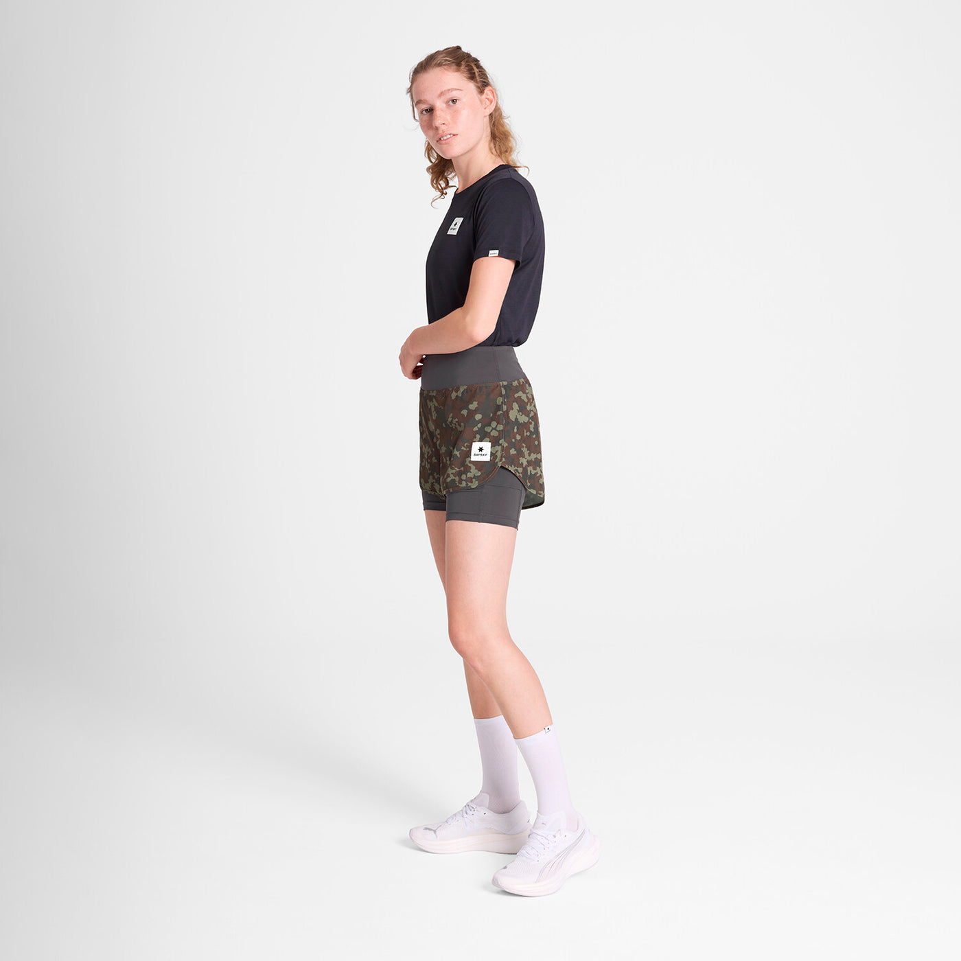 woman wearing saysky camo pace 2in1 run shorts for women with logo at front