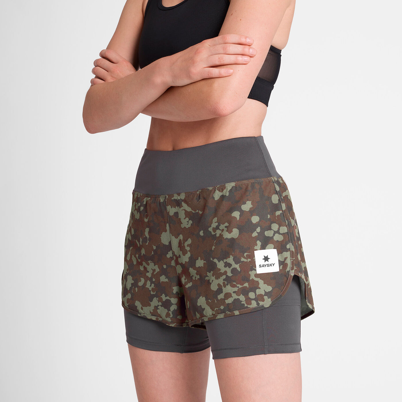 woman wearing saysky camo pace 2in1 run shorts for women with logo at front