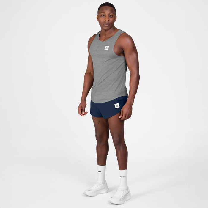 saysky clean combat pro singlet for men, lightweight tank for running or the gym, grey colour, full body profile of man wearing singlet with navy shorts on a white background