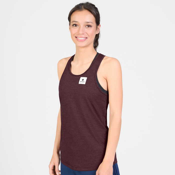 saysky clean combat pro singlet for women, lightweight tank for running or the gym, burgundy colour, model wearing singlet with navy shorts on a white background