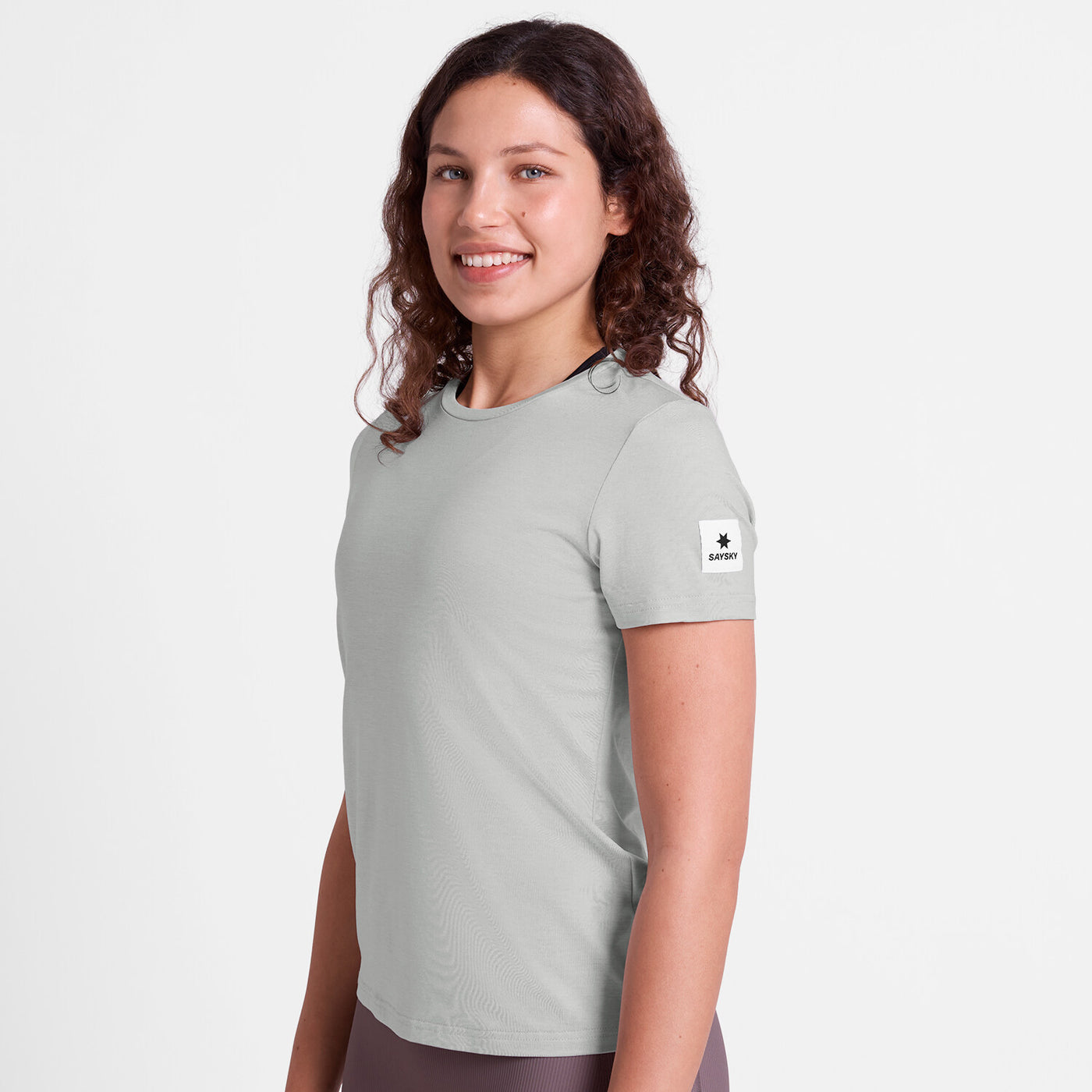 saysky clean pace tshirt for women, quick dry soft running tshirt, light grey colour, woman wearing grey saysky running top 