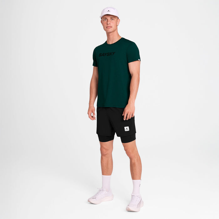 Man wearing a saysky logo pace green t-shirt 