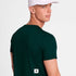 man showing the back of a SAYSKY logo pace green t-shirt with logo