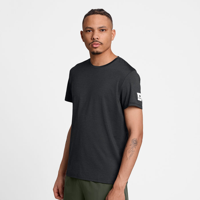 saysky clean pace t-shirt, short sleeve running t-shirt for men in black, stretchy and quick-drying tee, profile of man wearing saysky t-shirt on a white background
