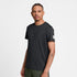 saysky clean pace t-shirt, short sleeve running t-shirt for men in black, stretchy and quick-drying tee, profile of man wearing saysky t-shirt on a white background